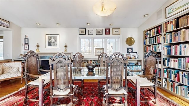 dining room with hardwood / wood-style flooring