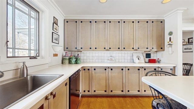 kitchen featuring sink, dishwasher, ornamental molding, light hardwood / wood-style floors, and backsplash