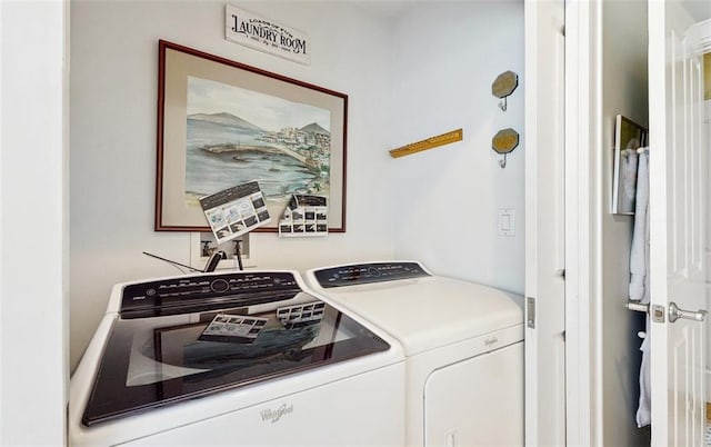 laundry room with washing machine and clothes dryer