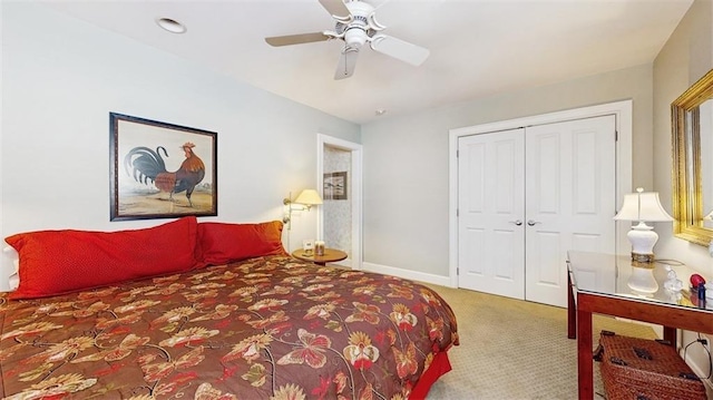 bedroom featuring carpet floors, ceiling fan, and a closet