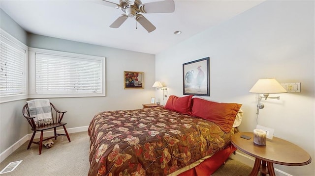 bedroom featuring ceiling fan and carpet