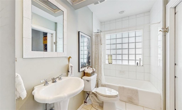 full bathroom with sink, shower / bath combo, tile patterned floors, and toilet