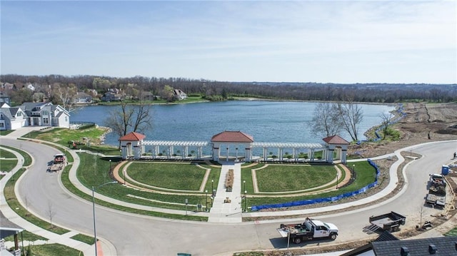 birds eye view of property with a water view