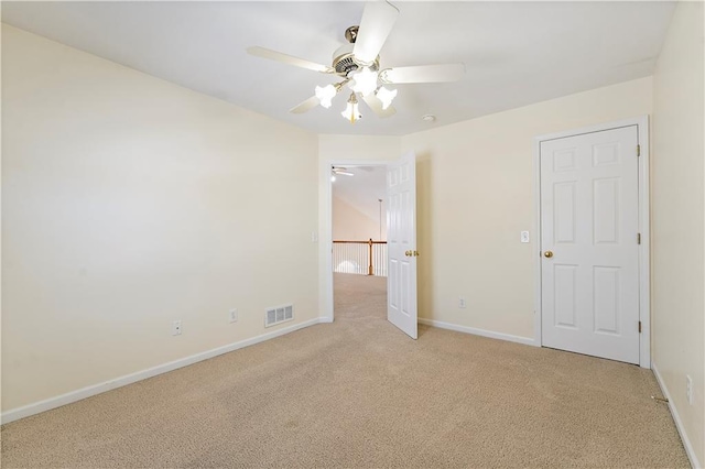 unfurnished bedroom with ceiling fan and light carpet