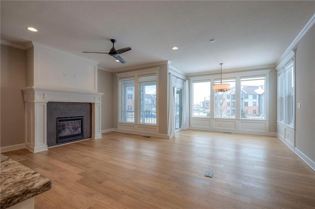 unfurnished living room featuring light wood-type flooring and ornamental molding