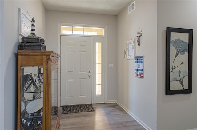 foyer entrance with light hardwood / wood-style flooring