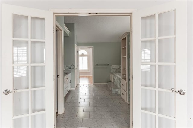 bathroom with a bath and a textured ceiling