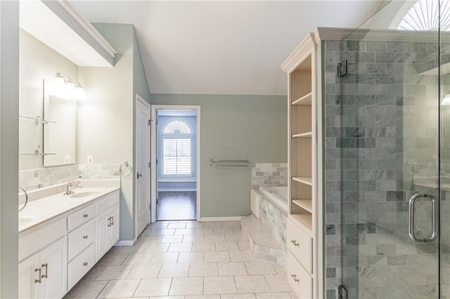 full bath with double vanity, a stall shower, and a sink