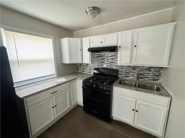 kitchen featuring black range with gas stovetop, white cabinets, and sink