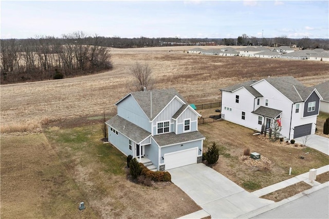 birds eye view of property with a residential view