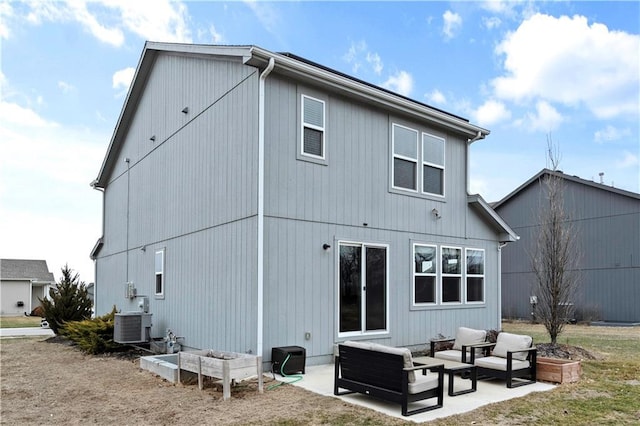 back of property featuring an outdoor hangout area, a yard, a patio area, and cooling unit