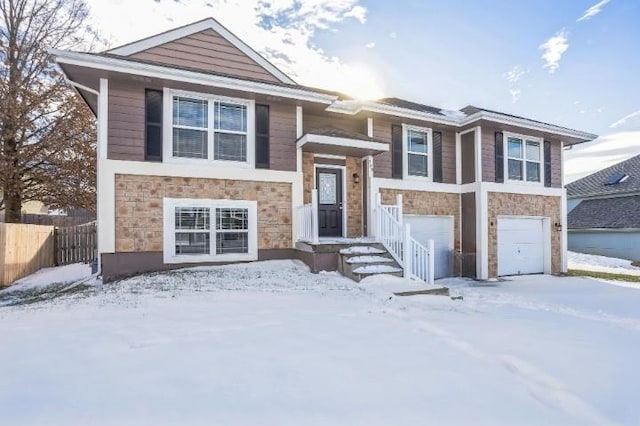 bi-level home featuring a garage