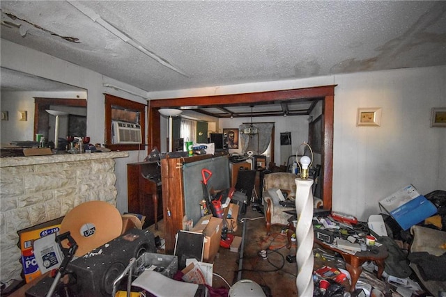 miscellaneous room with a textured ceiling and cooling unit