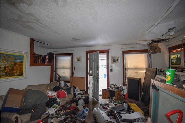 miscellaneous room with a textured ceiling