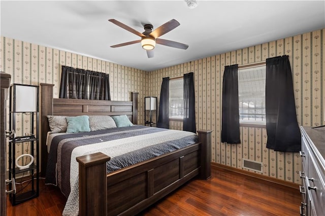 bedroom with ceiling fan and dark hardwood / wood-style floors