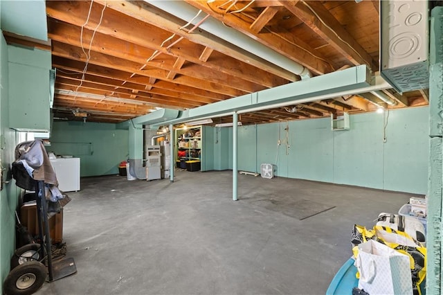 basement featuring washer / clothes dryer and heating unit