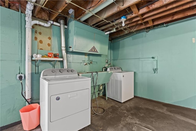 clothes washing area featuring independent washer and dryer