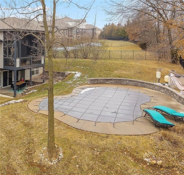 view of swimming pool featuring a patio area and a lawn