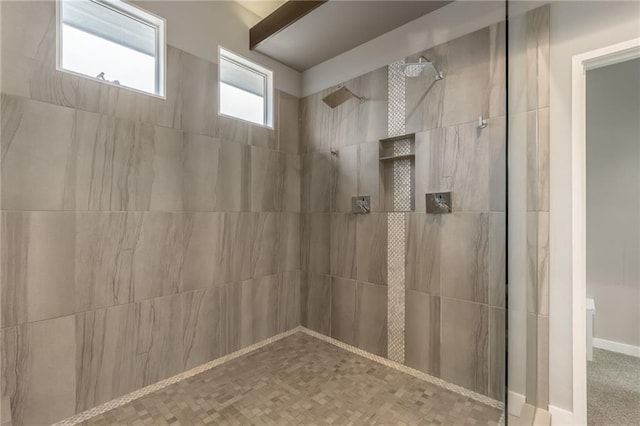 bathroom featuring tiled shower