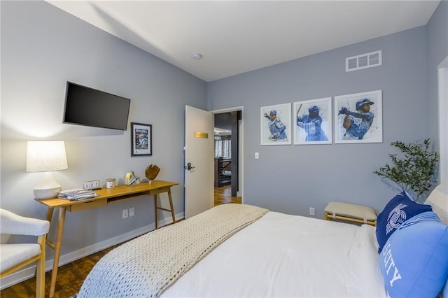 bedroom featuring dark wood-type flooring