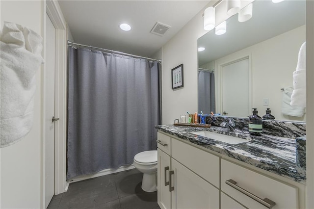 bathroom with tile patterned flooring, vanity, a shower with curtain, and toilet