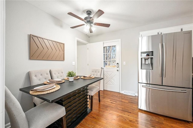 dining space featuring hardwood / wood-style floors and ceiling fan