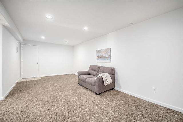 living area featuring carpet