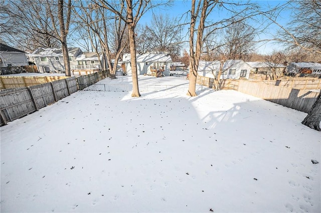 view of yard covered in snow