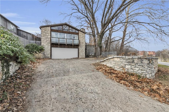 exterior space with fence and driveway