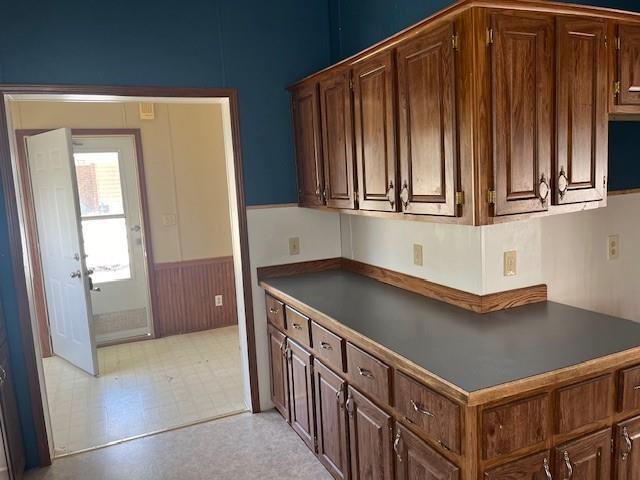 kitchen featuring dark brown cabinetry