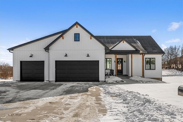 modern farmhouse featuring a garage