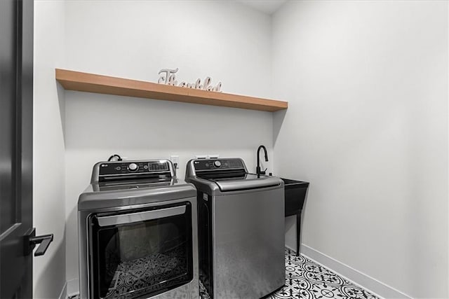 washroom with independent washer and dryer