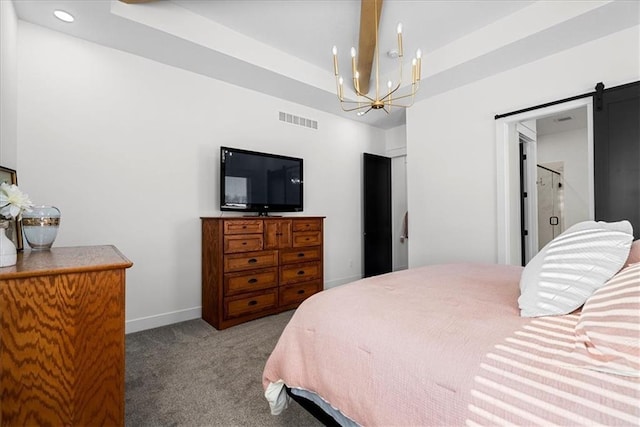 bedroom with carpet, a raised ceiling, a chandelier, and a barn door