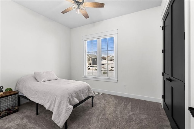 carpeted bedroom featuring ceiling fan