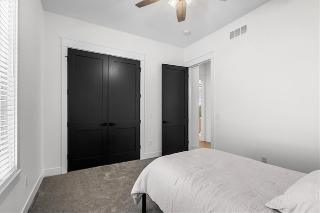 bedroom featuring ceiling fan, a closet, and carpet flooring