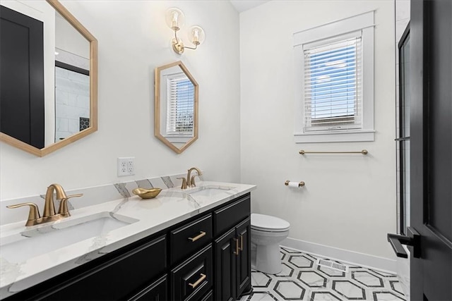 bathroom featuring toilet and vanity