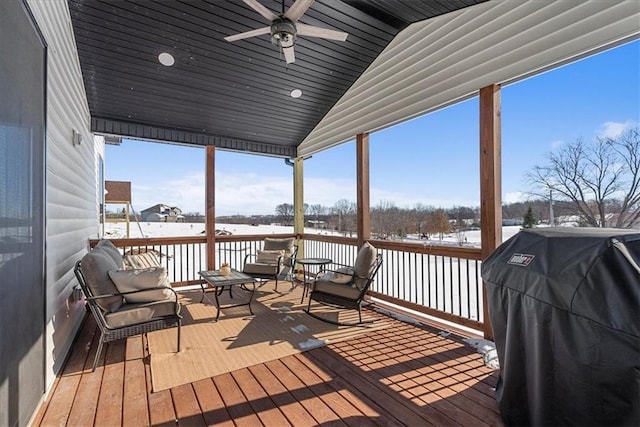 snow covered deck featuring grilling area and ceiling fan