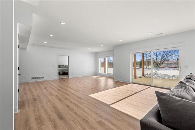 living room with light hardwood / wood-style flooring