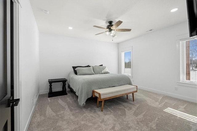 carpeted bedroom with ceiling fan