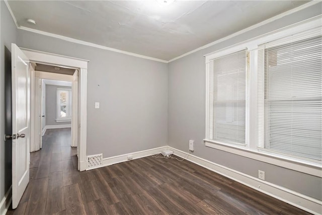 unfurnished room featuring crown molding and dark hardwood / wood-style floors