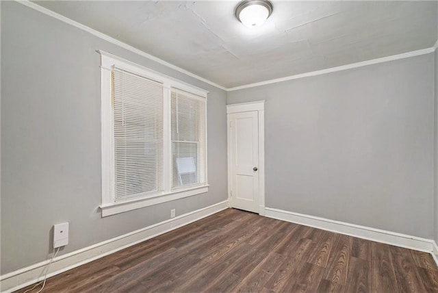 unfurnished room with crown molding and dark wood-type flooring