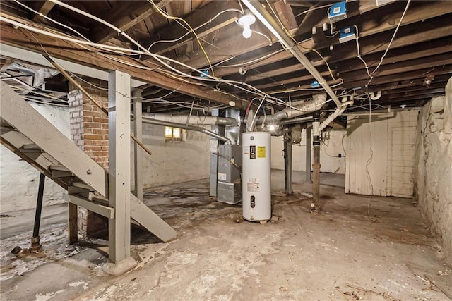 basement featuring gas water heater and heating unit