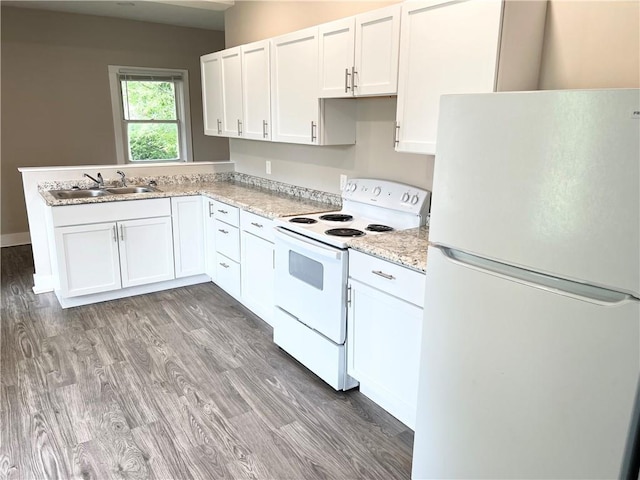 kitchen featuring sink, white cabinets, white appliances, and light wood-type flooring