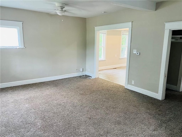 carpeted empty room with ceiling fan