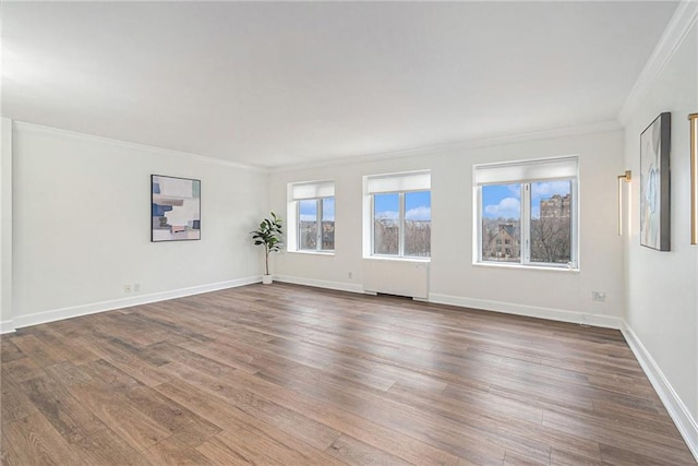 unfurnished room with crown molding and dark hardwood / wood-style flooring