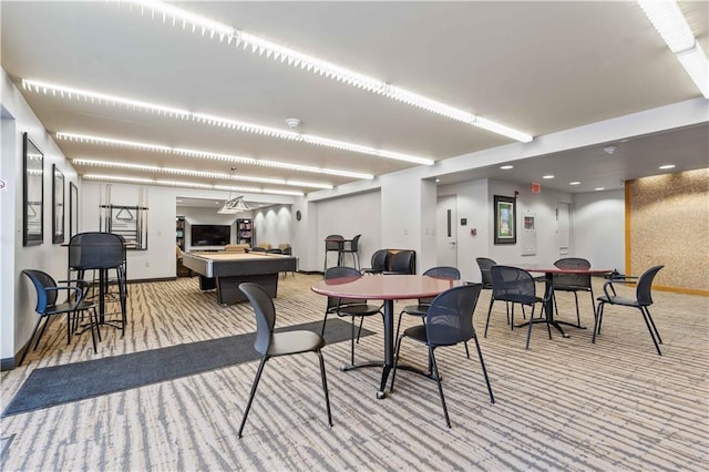 carpeted dining area featuring billiards