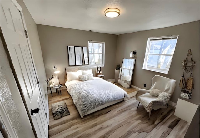 bedroom featuring light wood-type flooring