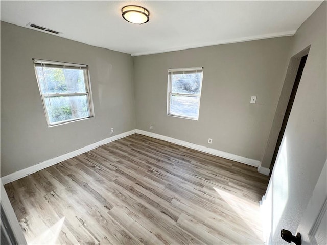 unfurnished room featuring light wood-type flooring