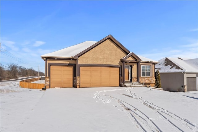 view of front of property featuring stone siding and stucco siding