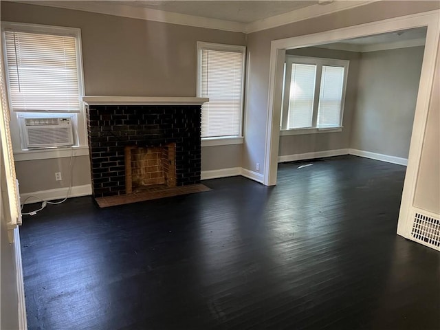 unfurnished living room featuring dark hardwood / wood-style floors, ornamental molding, a fireplace, and cooling unit